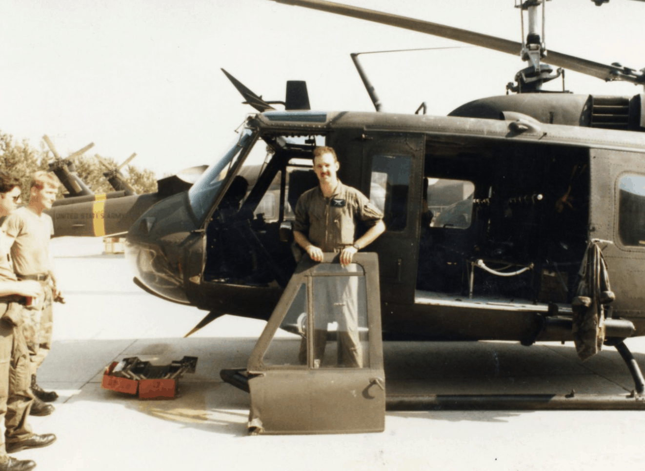 Ned Parks holding helicopter door
