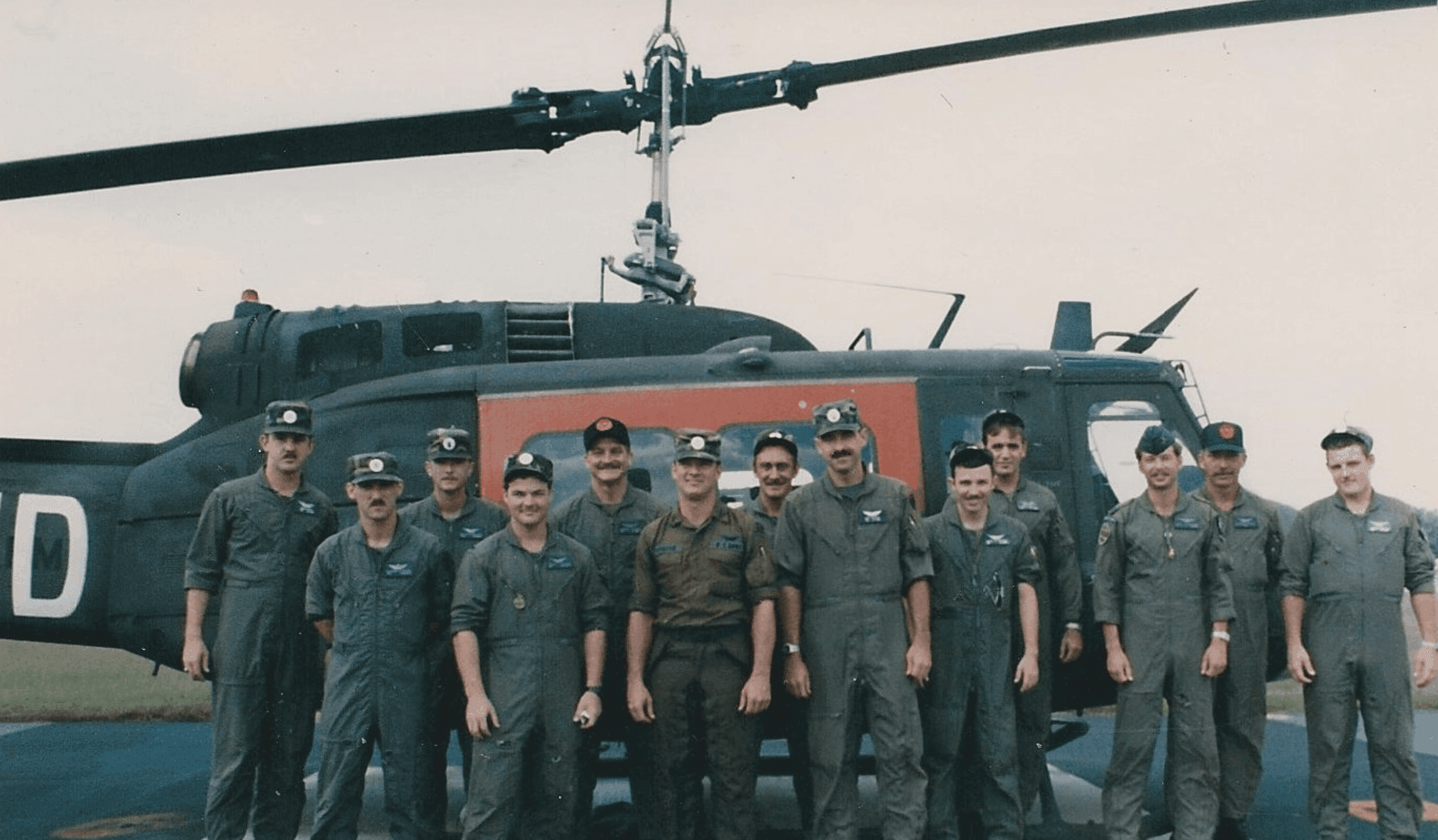 Flight Platoon standing in front of helicopter