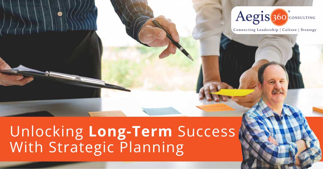 Unlocking Long Term Success With Strategic Planning - two people speaking in a meeting