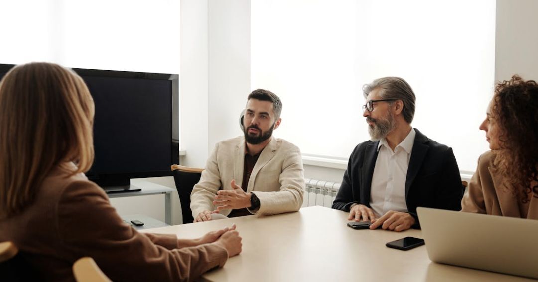 business people sitting at a table having a meeting