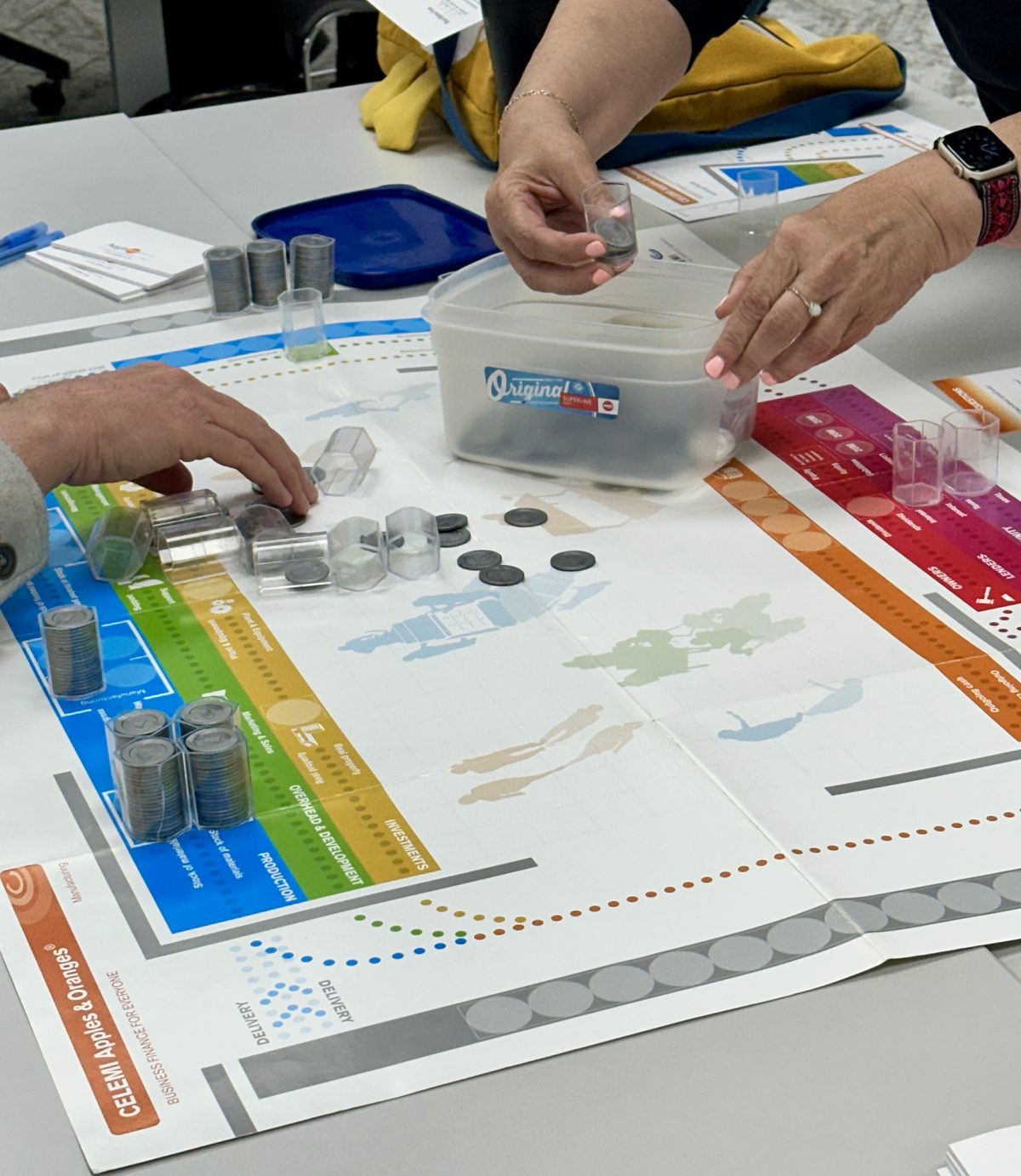 table where people are playing an interactive game with coins